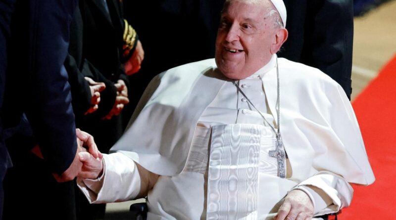 Pope Francis sitting down smiling